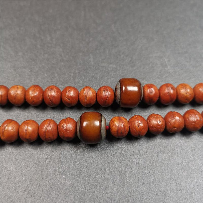 1 Pair of Yak Bone Beads 0.47" - Tibetan Buddhist art, close-up detail