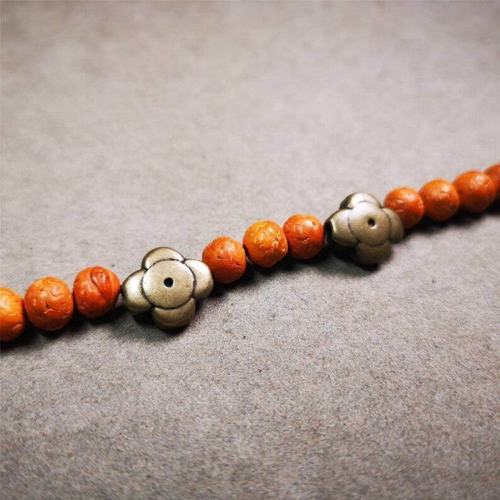Amulet ,Gesong Flower Marker Spacer Bead for Prayer Bead,Mala - Tibetan Buddhist mala beads, close-up detail