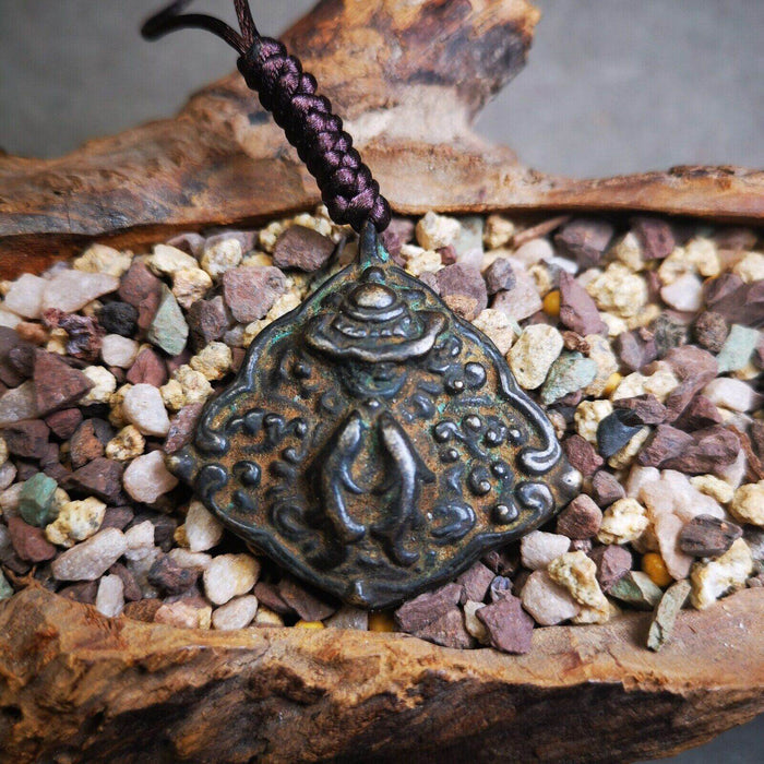 Buddhist Amulet, Vase and Golden Fish Badge,Thokcha - Tibetan Buddhist amulet, close-up detail