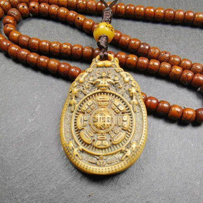 Buddhist Calendar Amulet,Yak Bone Carved Melong Mirror,SIPAHO srid pa ho Badge - Tibetan Buddhist amulet, detailed view