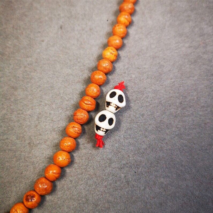 Citipati Skull Marker Beads 0.4" - Tibetan Buddhist art, front view