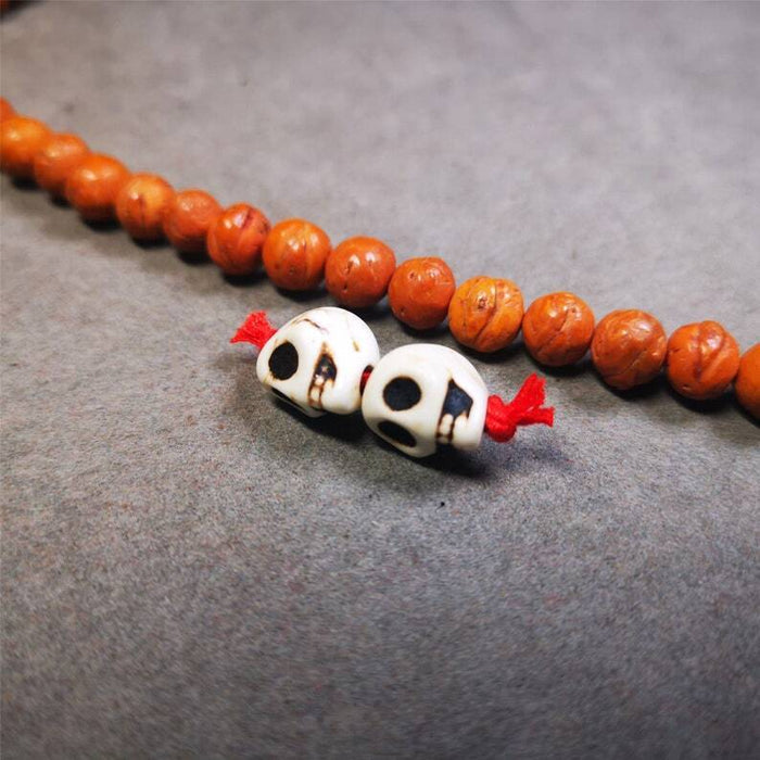 Citipati Skull Marker Beads 0.4" - Tibetan Buddhist art, close-up detail