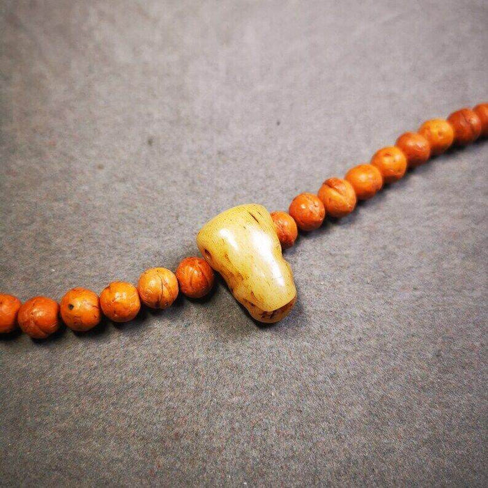 Guru Bead, T-drilled 3-Hole Bead for Prayer Bead - Tibetan Buddhist art, close-up detail
