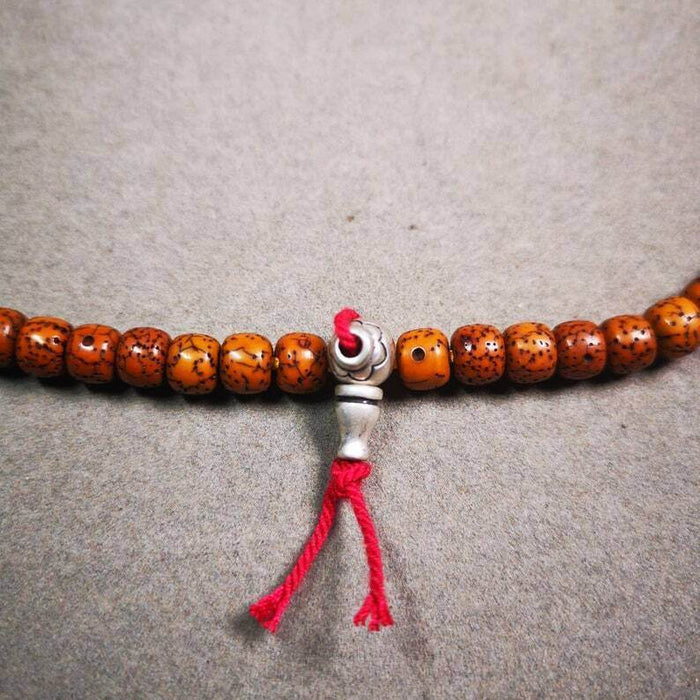 Guru Bead, T-drilled 3-Hole Bead - Tibetan Buddhist art, close-up detail