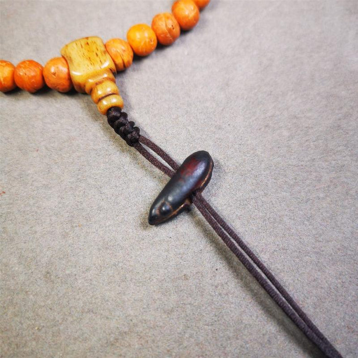 Highland Barley Seed Amulet 0.8" - Tibetan Buddhist amulet, front view