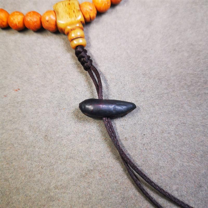 Highland Barley Seed Amulet 0.8" - Tibetan Buddhist amulet, detailed view