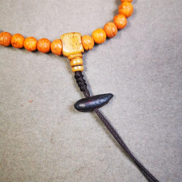 Highland Barley Seed Amulet 0.8" - Tibetan Buddhist amulet, close-up detail