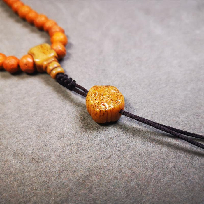 Lucky Knot Bead Amulet 0.63" - Tibetan Buddhist amulet, close-up detail