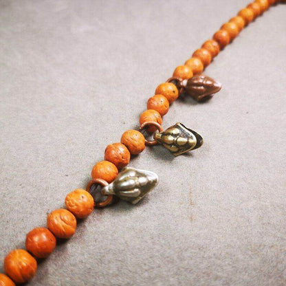 Mala Amulet,Mani Jewel/Wish-Fulfilling Cintamani - Tibetan Buddhist mala beads, close-up detail