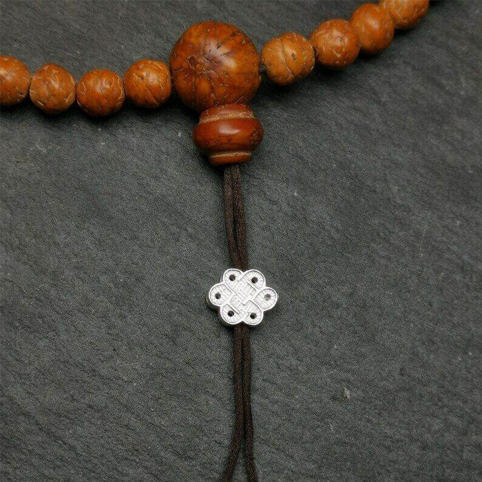 Mala Bead Pendant,Sterling Silver Lucky Knot Bead,Endless Knot - Tibetan Buddhist mala beads, close-up detail