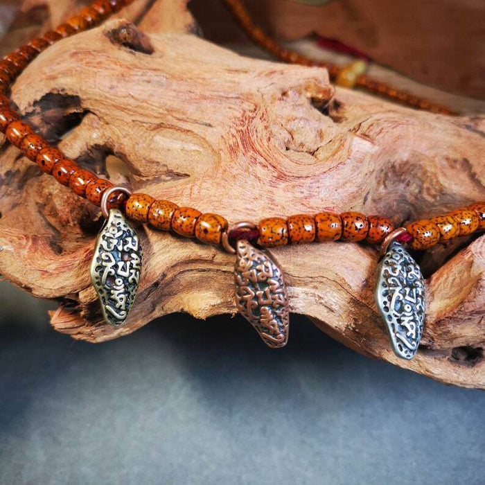 Mala Counter Pendant,OM Bead Amulet - Tibetan Buddhist mala beads, front view