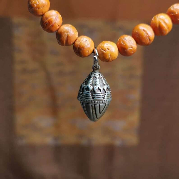 Mala Pendant,Niangla Tsa Tsa Stupa Gau Shrine Amulet - Tibetan Buddhist mala beads, front view