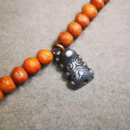 Mala Pendant,Snow Lion Amulet for Prayer Beads - Tibetan Buddhist mala beads, close-up detail