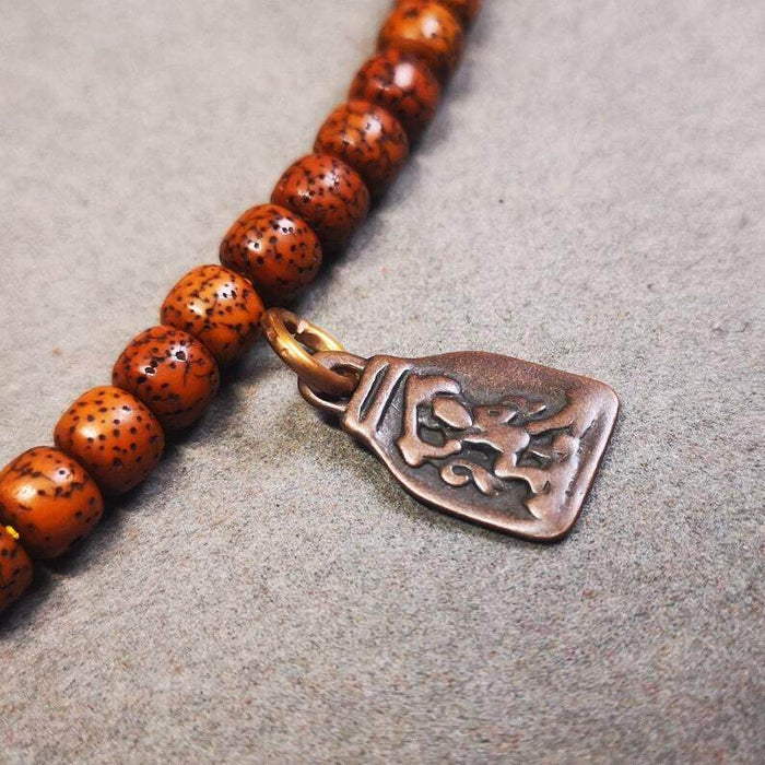 Mala Pendant,Vajrapani Amulet for Prayer Beads - Tibetan Buddhist mala beads, close-up detail