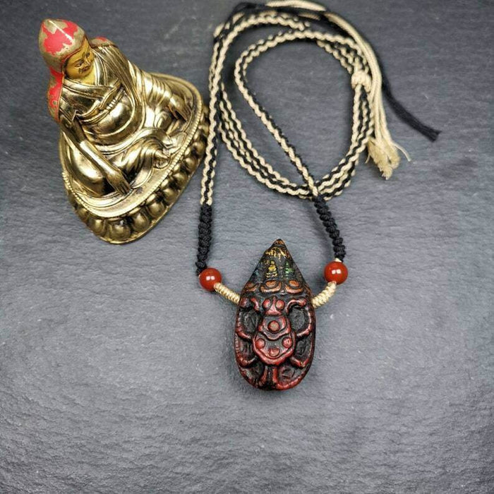 Old Tibetan Tsa Tsa Amulet, Scorpion Guru of Padmasambhava,Scorpion Terma Amulet - Tibetan tsa tsa mold, close-up detail