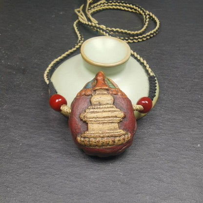 Stupa Tsa Tsa Amulet, Scorpion Guru of Padmasambhava, Scorpion Terma Pendant - Tibetan Buddhist amulet, close-up detail