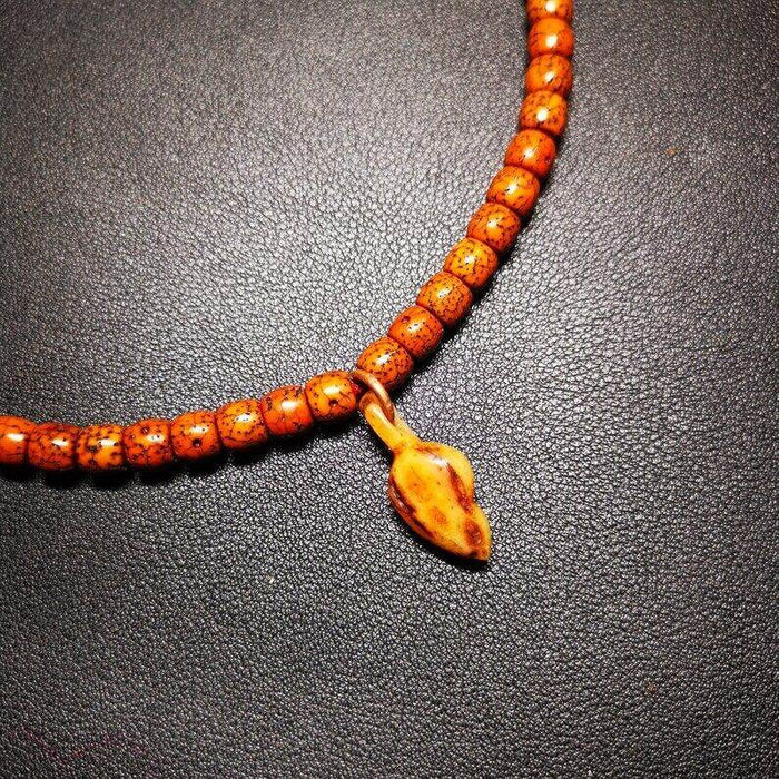 Yak Bone Carved Conch Prayer Bead Pendant,Bead Counter Clip Amulet for Mala - Tibetan Buddhist mala beads, close-up detail