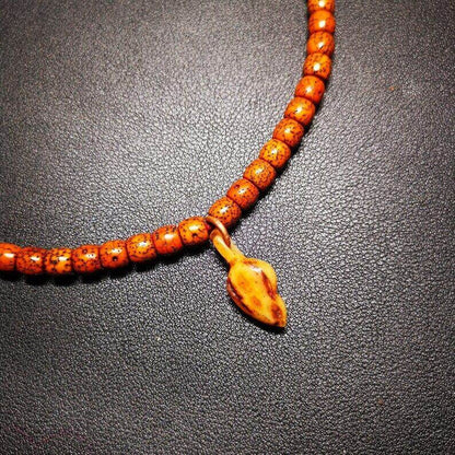 Yak Bone Carved Conch Prayer Bead Pendant,Bead Counter Clip Amulet for Mala - Tibetan Buddhist mala beads, close-up detail
