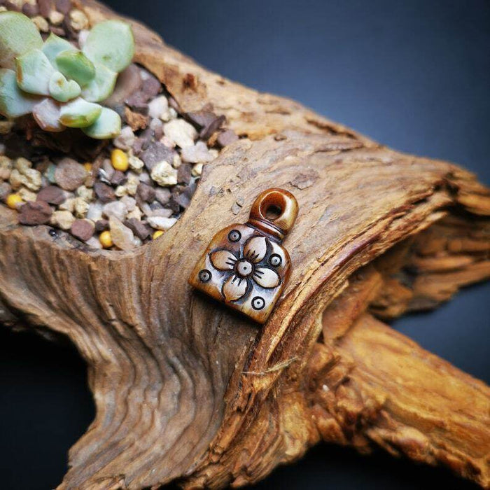 Yak Bone Carved Flower Prayer Bead Pendant - Tibetan Buddhist art, close-up detail