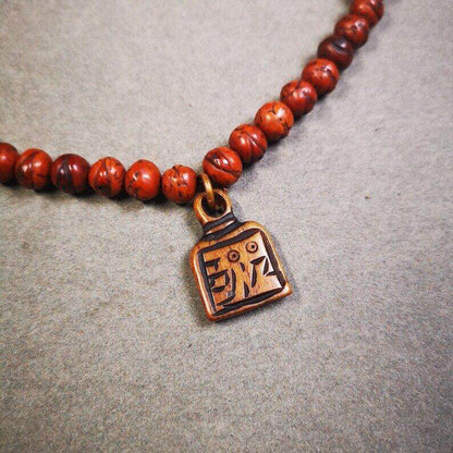 Yak Bone Carved Letter Prayer Bead Pendant - Tibetan Buddhist art, front view