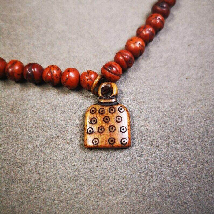 Yak Bone Carved Letter Prayer Bead Pendant - Tibetan Buddhist art, detailed view