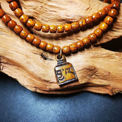 Yak Bone Carved Letter Prayer Bead Pendant - Tibetan Buddhist art, detailed view