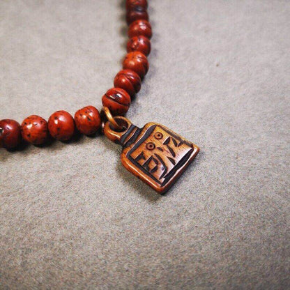 Yak Bone Carved Letter Prayer Bead Pendant - Tibetan Buddhist art, close-up detail