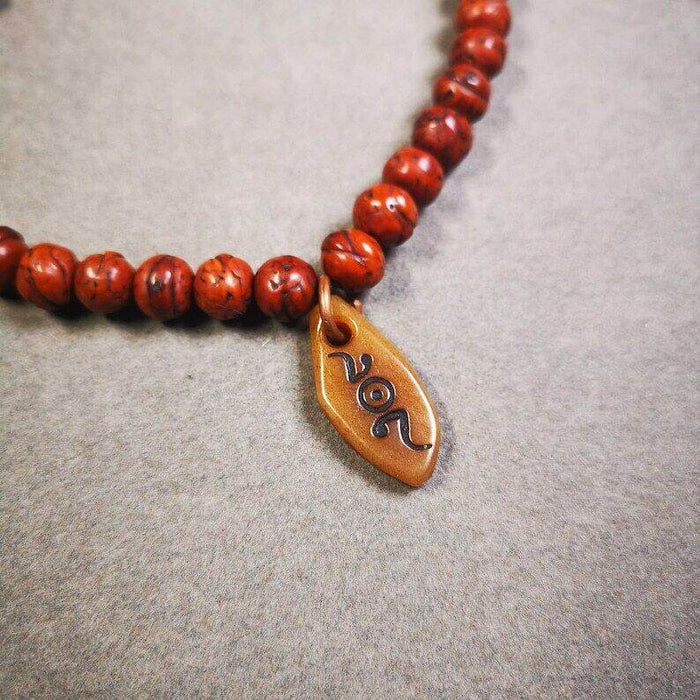 Yak Bone Carved Mani Jewel Prayer Bead Pendant - Tibetan Buddhist art, detailed view