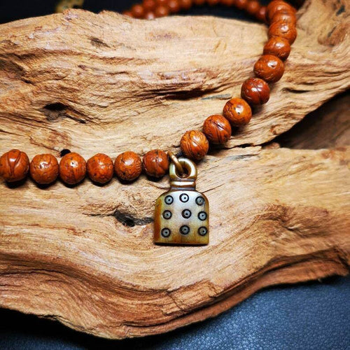 Yak Bone Carved Mantra Dot Prayer Bead Pendant - Tibetan Buddhist art, front view