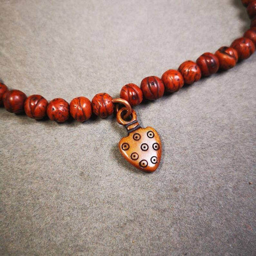 Yak Bone Carved Mantra Dot Prayer Bead Pendant - Tibetan Buddhist art, front view