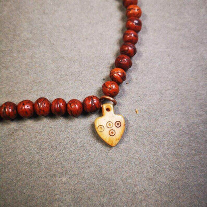 Yak Bone Carved Mantra Dot Prayer Bead Pendant - Tibetan Buddhist art, detailed view