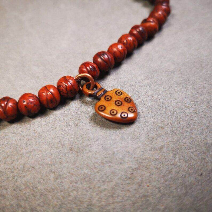 Yak Bone Carved Mantra Dot Prayer Bead Pendant - Tibetan Buddhist art, detailed view