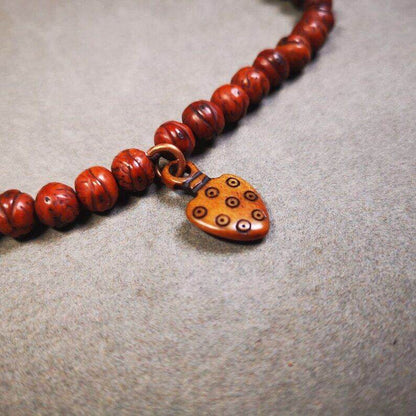 Yak Bone Carved Mantra Dot Prayer Bead Pendant - Tibetan Buddhist art, detailed view