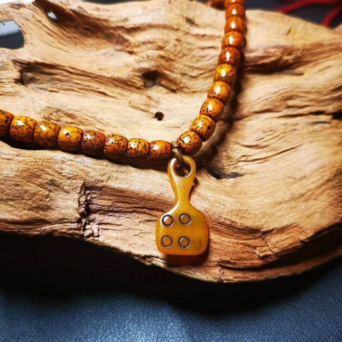 Yak Bone Carved Mantra Dot Prayer Bead Pendant,Bead Counter Clip Amulet for Mala - Tibetan Buddhist mala beads, close-up detail