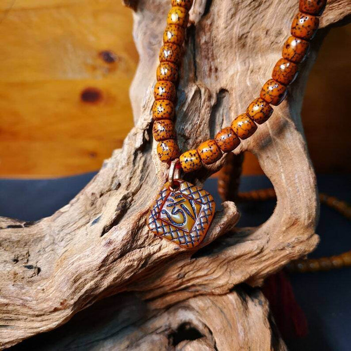 Yak Bone Carved OM Letter Prayer Bead Pendant,Bead Counter Clip Amulet for Mala - Tibetan Buddhist mala beads, close-up detail
