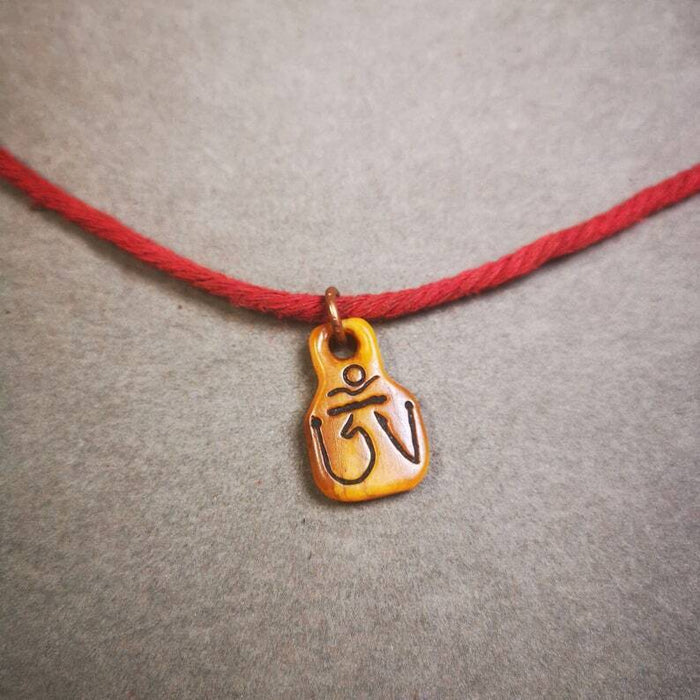 Yak Bone Carved Prayer Bead Pendant 0.98" - Tibetan Buddhist art, close-up detail