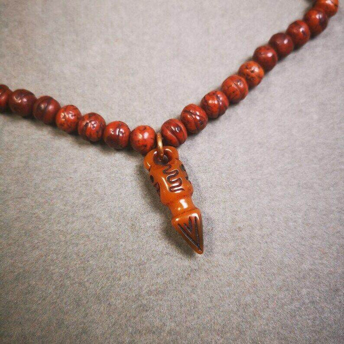 Yak Bone Carved Skull Phurba Amulet, Ritual Implement Pendant - Tibetan Buddhist amulet, detailed view