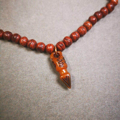 Yak Bone Carved Skull Phurba Amulet, Ritual Implement Pendant - Tibetan Buddhist amulet, detailed view
