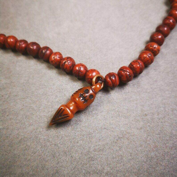Yak Bone Carved Skull Phurba Amulet, Ritual Implement Pendant - Tibetan Buddhist amulet, close-up detail