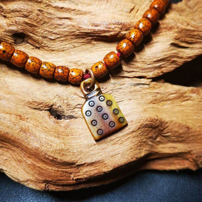Yak Bone Carved Skull Prayer Bead Pendant - Tibetan Buddhist art, detailed view