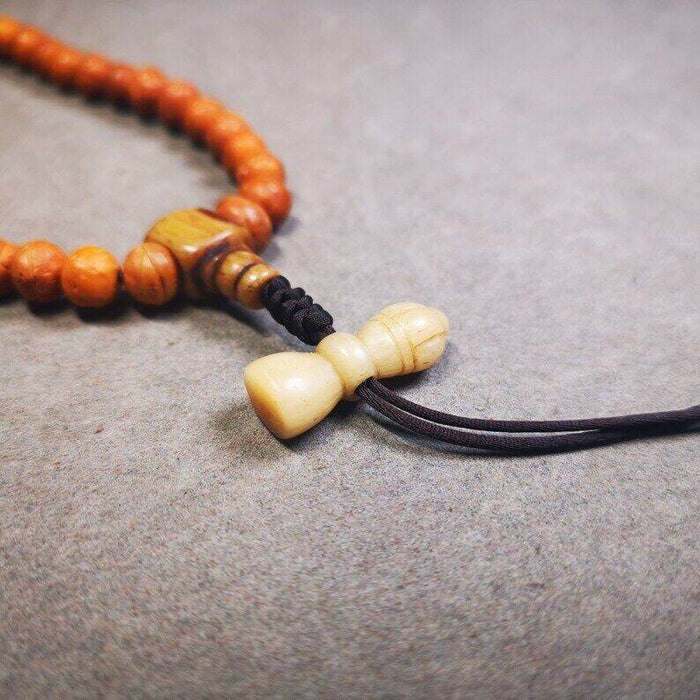 Yak Bone Carved Vajra Bell Amulet Pendant,Spacer Bead for Mala - Tibetan Buddhist mala beads, close-up detail